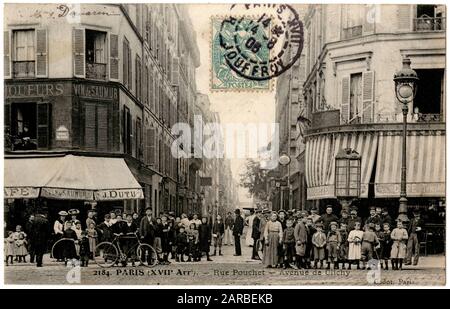 Rue Pouchet, off the Avenue de Clichy, 17th arrondissement, Paris, France, with a large group of people gathered for the photograph. Stock Photo