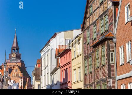 Historic facades and church tower in Gustrow, Germany Stock Photo