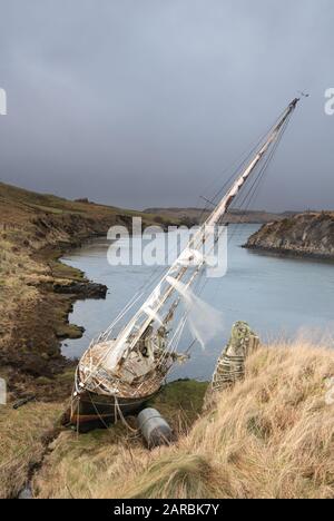 Ghost ship up the creek and going nowhere Stock Photo