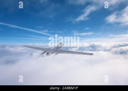 Unmanned aerial vehicles flies out of the clouds over the territory of patrol Stock Photo