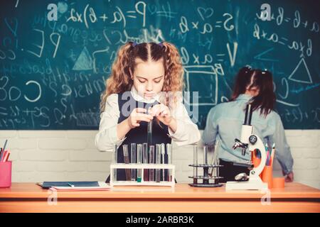 Confident medical experts. childrens day. Little children at school lesson. students doing biology experiments with microscope. Chemistry. Back to school. Little kids learning chemistry in school lab. Stock Photo