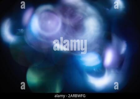 Blue abstract blurred shiny glitter lamp lights background. Abstract blurred highlights. Stock Photo