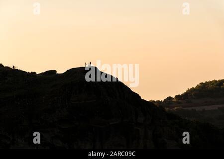 Kalabaka, Greece. Silhouetted photographers taking pictures of the monasteries of Meteora in the early morning Stock Photo