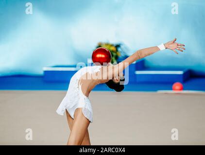 girl athlete gymnast performance with ball in rhythmic gymnastics Stock Photo