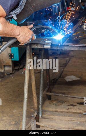 Man welding in a workshop Stock Photo