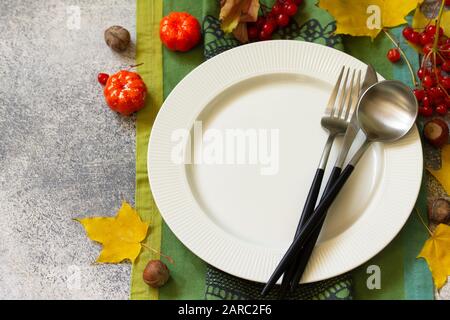 Autumn rustic table. Thanksgiving or autumn harvest table setting on stone or slate table. Stock Photo