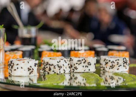 Sushi roll japanese food on black plate. Sushi roll set with salmon, caviar rice and vegetables. Japan restaurant menu. Stock Photo