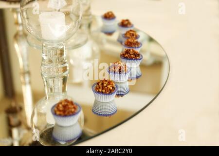 Various fine chocolates pralines on plate, dark and milk chocolate. Wedding concept. Stock Photo