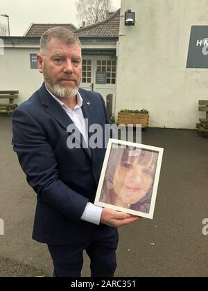 Kevin O'Connor holds a picture of his wife Julie outside Avon Coroner's Court in Flax Bourton, near Bristol. Stock Photo