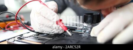 Man soldering laptop parts Stock Photo