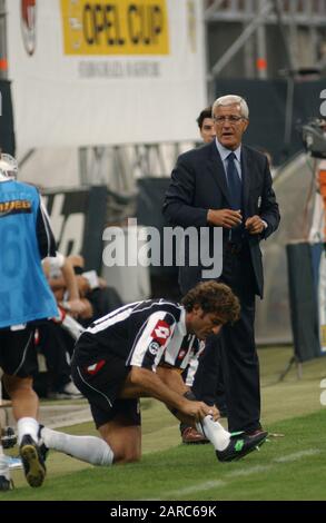 Milan  Italy, 18 August  2002, 'G.MEAZZA SAN SIRO ' Stadium, XII Trofeo Berlusconi 2002/2003,  AC Milan - FC Juventus:The coach of the Juventus, Marcello Lippi and the defender Ciro Ferrara during the match Stock Photo