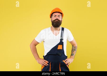 man builder in hardhat headwear. keep head safe in helmet. building improvement and renovation. brutal male painter ready to work. choose your occupation. our best quality. engineer in uniform. Stock Photo