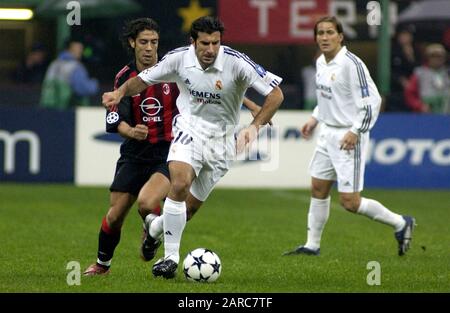 Milan Italy  26 November 2002, 'G.MEAZZA SAN SIRO ' Stadium,  UEFA Champions League 2002/2003, AC Milan - CF Real Madrid:   Luis Figo and Rui Costa in action during the match the match Stock Photo