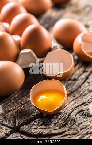Fresh raw eggs on rustic wooden table