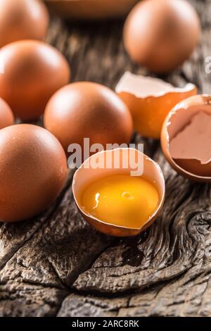 Fresh raw eggs on rustic wooden table Stock Photo