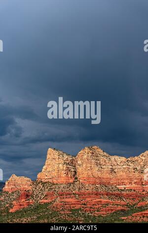 Red rocks in Sedona, Arizona with dark clouds and sky Stock Photo