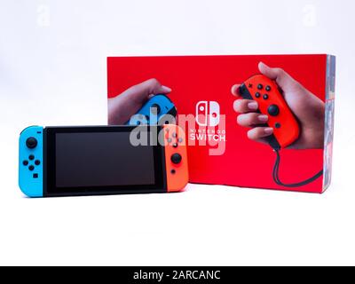 UK, Jan 2020: Nintendo switch console with controllers on box Stock Photo