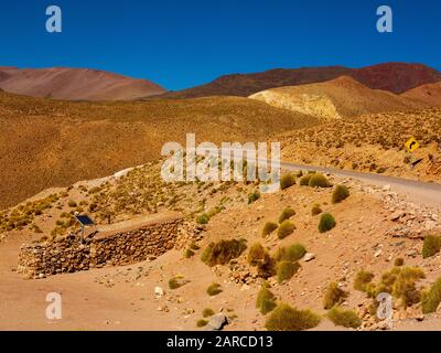 Typical stony Andean house as seen from the Ruta 51 on the way to Paso Sico on the Chile border, Argentina Stock Photo