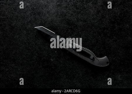 Closeup shot of an EDC pocket knife with a black holder Stock Photo