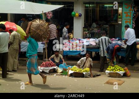 Dhaka, Bangladesh - September 17, 2007: Unidentified people and street vendors on traditional market Stock Photo