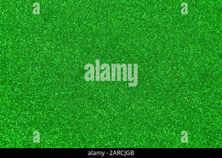 Abstract green colored blured sparkling background. Luxurious glittering texture for design. Stock Photo