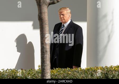 Washington, DC, USA. 27th Jan, 2020. United States President Donald J. Trump walks through the colonnade of the White House in Washington, DC, U.S., on Monday, January 27, 2020. Credit: Stefani Reynolds/CNP | usage worldwide Credit: dpa/Alamy Live News Stock Photo