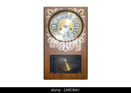 Large wall clock made of wood, isolated on a white background with a clipping path. Stock Photo