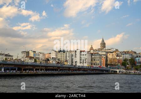 The Galata Bridge in Istanbul, Turkey. The bridge spans the Golden Horn, a natural estuary connecting the Bosphorus Strait and the Sea of Marmara. Stock Photo