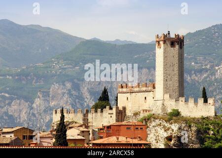 view west to 13th Century castle, Malcesine, Lake Garda, Dell 'Alto Garda hills in background, Italy Stock Photo