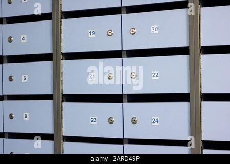 Blue mailbox doors with numbers close up, background Stock Photo