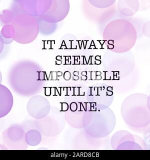 Inspirational Quote - it always seems impossible until it's done with White and purple background Stock Photo