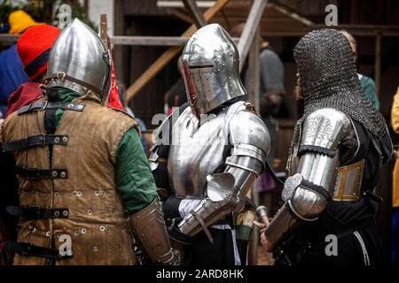 Knights in armour undertake medieval combat at historical re-enactment tournament. Queensland Australia Stock Photo
