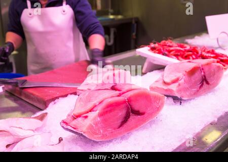 Cuts of tuna fish on display at fishmonger Stock Photo