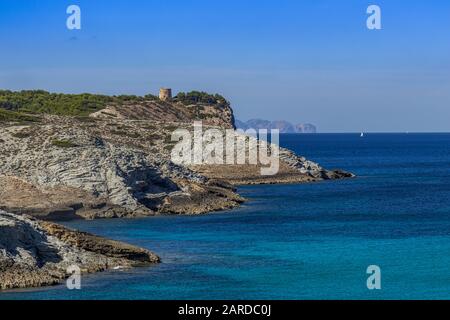 Northeast coastline of Mallorca with view to old watchtower Torre d'Aubarca near the bay Cala Matzoc, Cala Mesquida, Mallorca, Balearic Islands, Spain Stock Photo