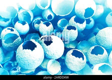 Cracked eggs pattern on classic blue color background. Top view, flat lay, selective focus. Easter creative minimal concept. Classic Blue color of the Year 2020 inscription. Stock Photo
