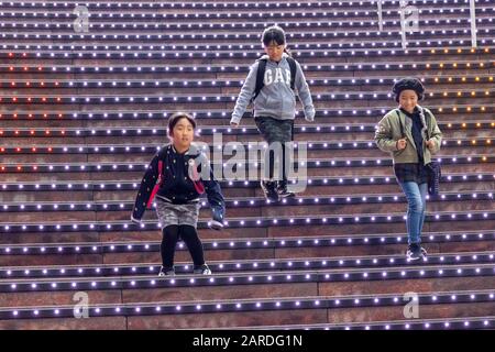 children playing on staircase with lights, Kyoto Station, Kyoto, Japan Stock Photo