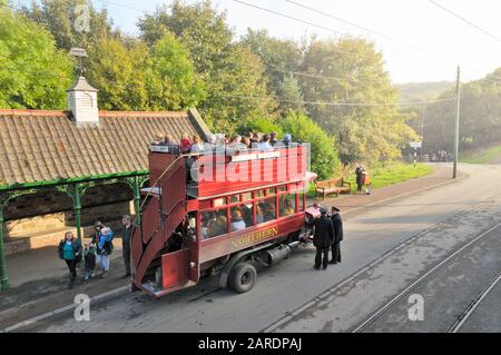 Tourists on a replica open top double decker bus at the Beamish Open Air Museum, The Living Museum of the North, County Durham, North East England, UK Stock Photo