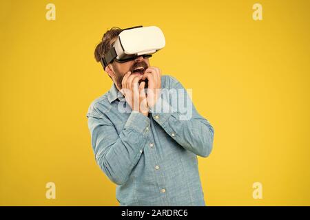Augmented reality. Game development. Digital technology. Living alternative life. Hipster play video game. Impressive visual effects. Bearded man explore vr. Gamer concept. Gaming hobby. Cyber sport. Stock Photo