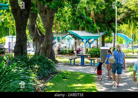 People walking along path on the Strand foreshore, Townsville Queensland Australia Stock Photo