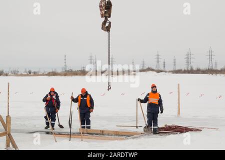 Workers with shovels in the hands of a lane Stock Photo