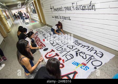 Students of the University of Antioquia preparing parade banners for the march of October 10, 2018.The student movement demanded a greater investment Stock Photo