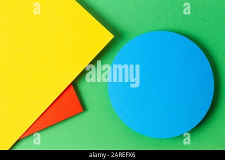 Abstract colored paper texture background. Minimal geometric shapes and lines in yellow, red, light blue and green colours Stock Photo