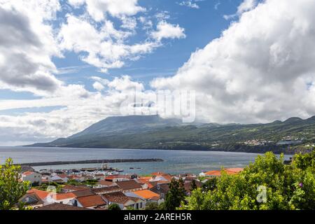 Orange roofs adorn houses in Lajes do Pico village on Pico island in the Azores, Portugal. Stock Photo