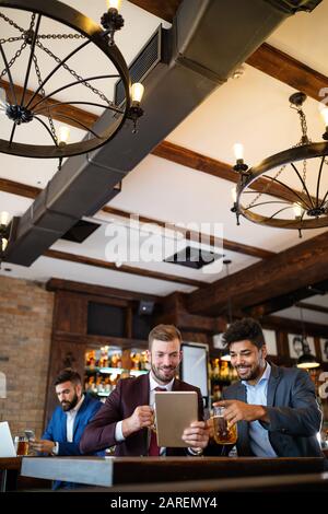 Handsome two businessmen have a meeting in a restaurant Stock Photo