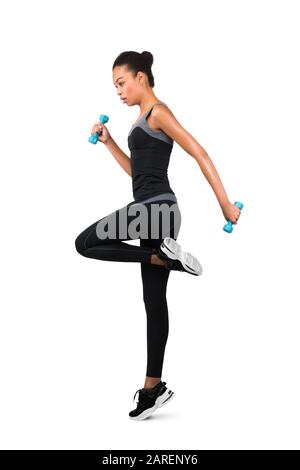 Fitness Lady Exercising Jumping With Dumbbells On White Background, Full-Length Stock Photo