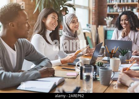 Cheerful business team having morning briefing in office Stock Photo
