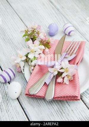easter table settings with fresh blossom on a old wooden table Stock Photo