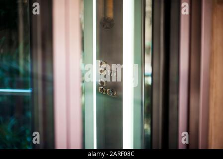 Interior and closeup of metal buttons in elevator Stock Photo