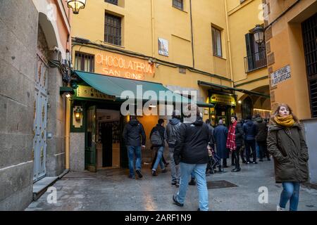 Madrid, Spain - January 25, 2020: Famous Chocolatería San Ginés selling chocolate churros located in Pasadizo de San Gines.
