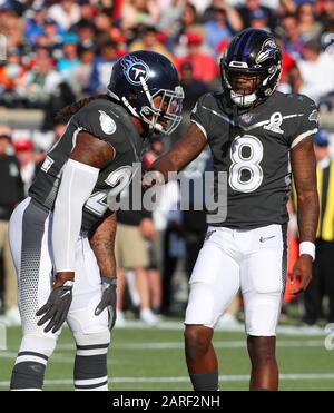 AFC running back Derrick Henry of the Tennessee Titans (22) and quarterback Lamar  Jackson of the Baltimore Ravens (8) during the Pro Bowl, Sunday, Jan. 26,  2020, at Camping World Stadium in